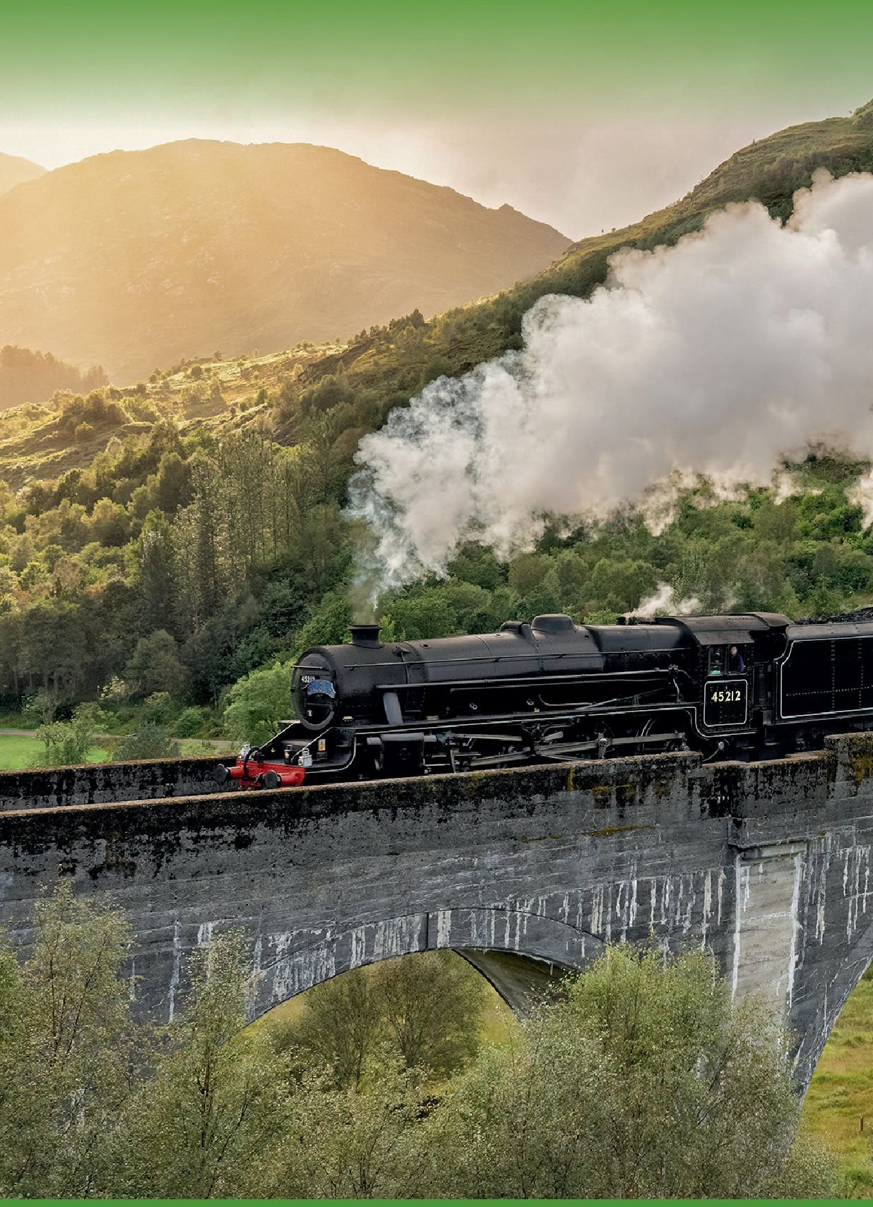 A steam train crossing the Glenfinnan Viaduct in the Scottish Highlands